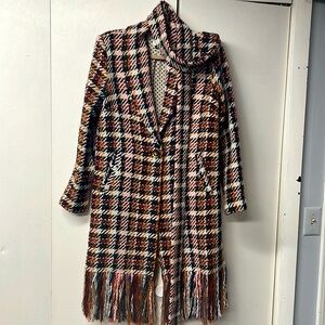 Beautiful, unlined woven coat with fringe along the bottom.